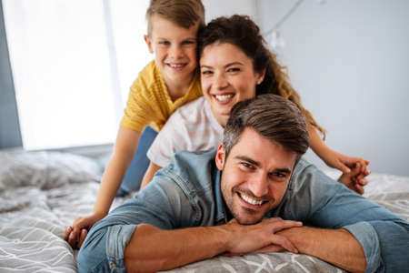 Happy family having fun time at homeの写真素材