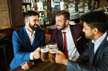 People, men, leisure, friendship and celebration conceptの写真素材