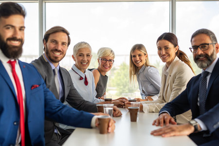 Portrait of successful business team posing in officeの写真素材
