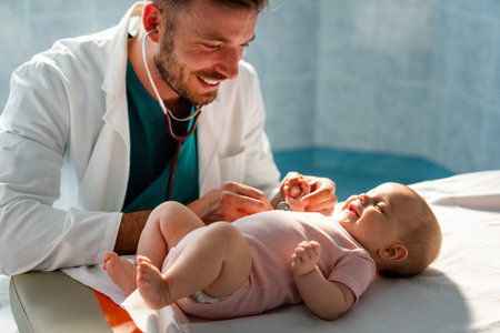 Pediatrician doctor examines baby. Healthcare, people, examination conceptの写真素材