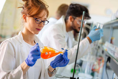 Group of medical scientists working at laboratory. Science, chemistry, medicine and people conceptの写真素材