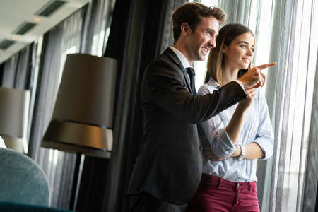 Happy satisfied couple looking and planning their future, vision
