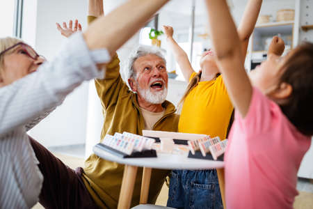 Family, generation love and people concept. Happy grandparent having fun with children at home