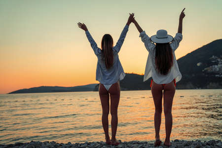 Women, friend having fun on the beach on summer vacationの写真素材