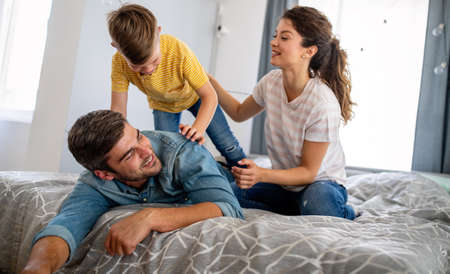 Happy family having fun time at homeの写真素材