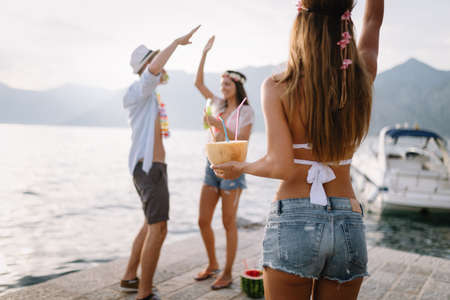 Group of friends enjoy on the beach on summer vacationの写真素材