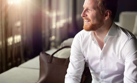 Portrait of a handsome young businessman smilingの写真素材