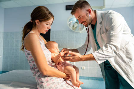 Portrait of happy mother with baby, medical pediatrician doctors, nurseの写真素材