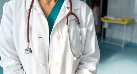 Portrait of a smiling medical mature doctor woman with stethoscope. Healthcare, people conceptの写真素材