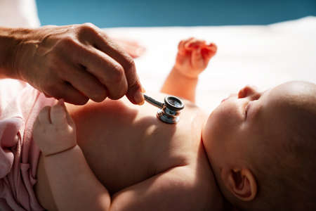 Pediatric doctor exams little baby. Health care, medical examination, people conceptの写真素材