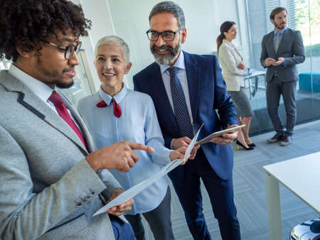 Collaboration and analysis by business people working in officeの写真素材