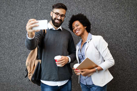 Business people talking outside company with holding coffee break time concept.
