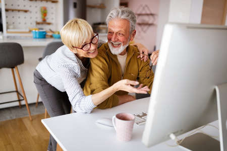 Senior retired couple learn about computer and online support.の写真素材