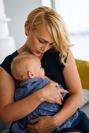 Mother comforting her crying little girl. Parenthood, family support conceptの写真素材