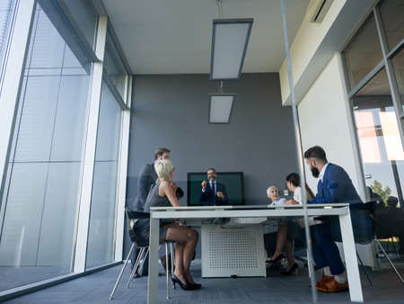 Diverse happy business people in board room meeting at the officeの写真素材