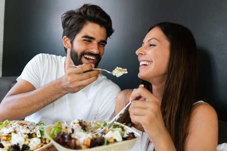 Beautiful happy couple in love in morning, spending time togetherの写真素材