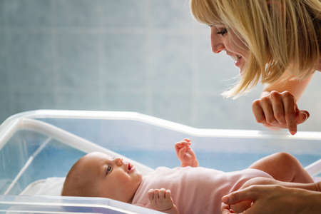 Portrait of a mother with her newborn baby
