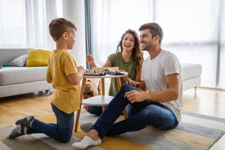 Happy family having fun time at homeの写真素材