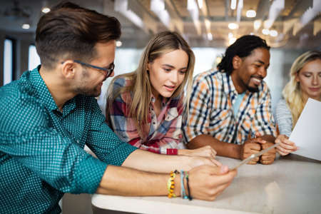 Group of diverse designers, business people brainstorming on meeting in officeの写真素材
