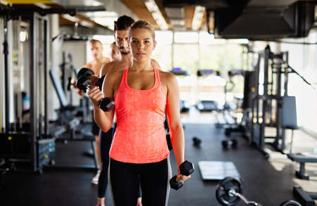 Sporty fit group working out together at gym. Sport healthy lifesytle people conceptの写真素材