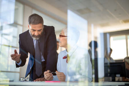 Senior business people working together in officeの写真素材