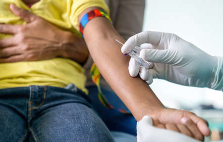 Doctor taking blood test from child patient. Healthcare, examination, kid concept.の写真素材