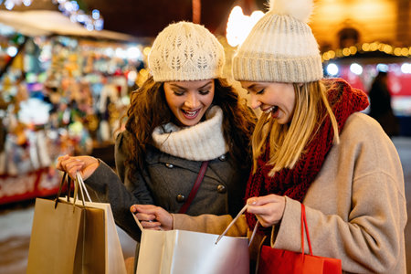 Portrait of cheerful young happy woman doing Christmas shopping. Christmas shopping people conceptの写真素材