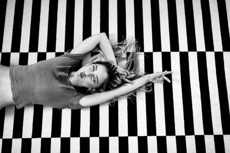 Portrait of fashionable and beautiful woman in stylish pose