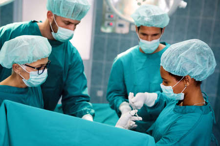 Group of surgeon at work in operating room in hospital