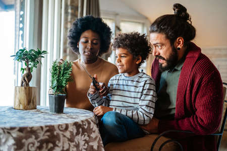Home hobbies gardening with children and learning botany. Family love happiness concept