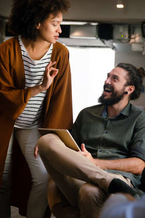 Portrait of creative business people team working together and smiling in office.の写真素材