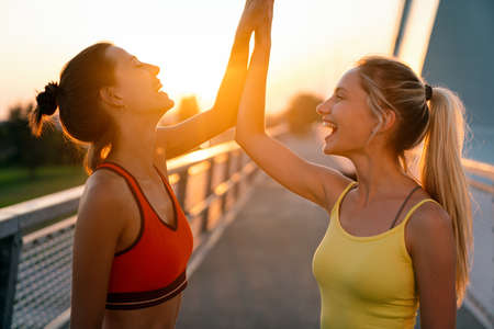 Group of fit women exercising together outdoor. People sport healthy lifestyle concept