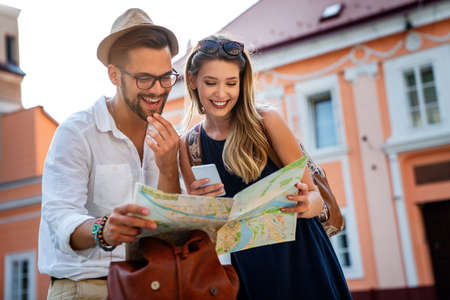 Happy tourist couple in love having fun, traveling smiling together on vacation