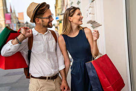 Happy young couple enjoying in shopping, having fun together. People love dating lifestyle conceptの写真素材