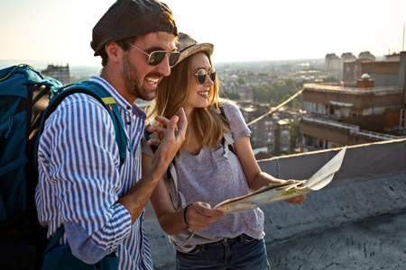 Holiday travel people tourism concept. Smiling couple having fun and enjoying summer vacation
