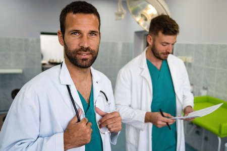 Medical staff having discussion in hospital. Healthcare workers, coronavirus and insurance concept.