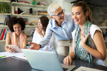 Group of successful business women working together in office. Business people meeting concept.の写真素材