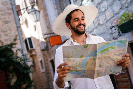 Young happy man traveler enjoying vacation, tourism and having funの写真素材