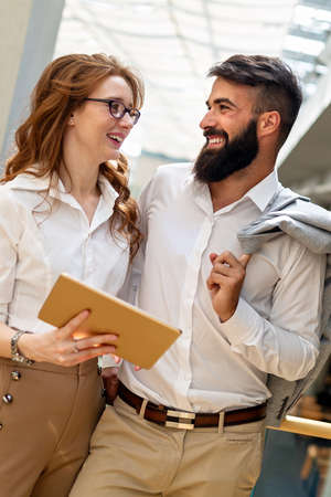 Business people having fun and chatting at workplace officeの写真素材