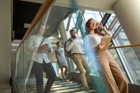 Group of young business people are working together in office. Successful team in coworking.