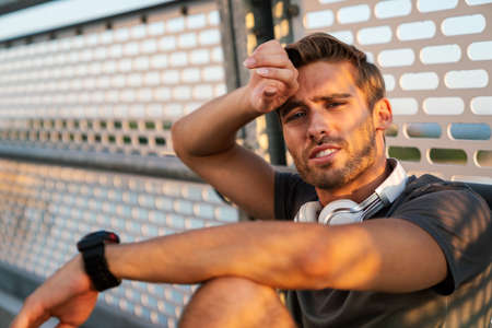 Fitness sport people lifestyle concept. Portrait of young man running to stay healthy outdoors.の写真素材