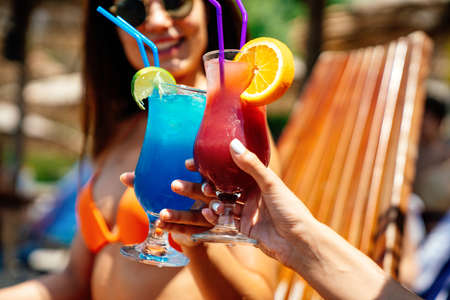 Beach background with a cocktail by the sea. Travel people vacation summer drink conceptの写真素材
