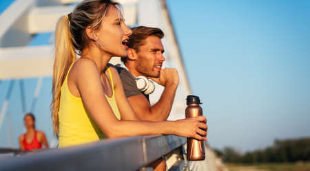 Fitness sport people running lifestyle concept. Group of young people jogging together outdoors.の写真素材