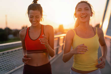 Group of fit women exercising together outdoor. People sport healthy lifestyle conceptの写真素材