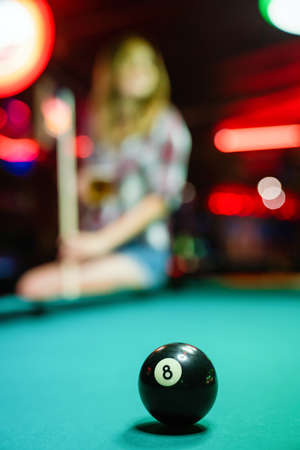 8 Ball from pool or billiards on a billiard table. People entertainment game conceptの写真素材