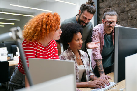 Team of young creative marketing experts brainstorming during work