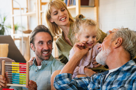 Cheerful multi-generation family having fun while spending time together at home.