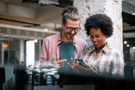 Successful business people, designer enjoying work together. Business people tecgnology conceptの写真素材