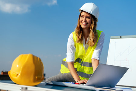Construction concept of engineer or architect woman working at construction site.の写真素材