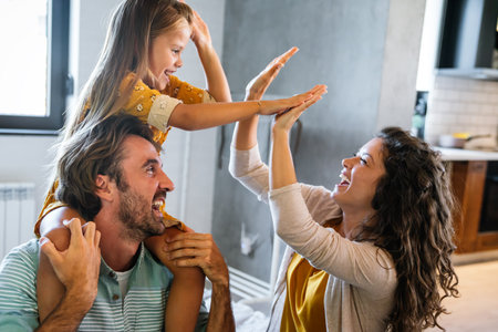 Happy family having fun time at home. People love child home concept.の写真素材